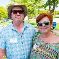Shannan Denison '99 and Kevin Hubbard pose for a picture as they eat snacks